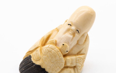 An Antique Japanese Carved Ivory Nestuke of Fukurokuju