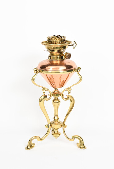 An Art Nouveau brass and copper oil lamp