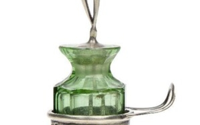 An Art Nouveau silver and glass cayenne pepper pot with spoon, Mark of Levi & Salaman, Birmingham 1903, The silver mount with openwork sides decorated with sinuous tendrils, loop handle and three feet, having a green glass faceted liner, the...