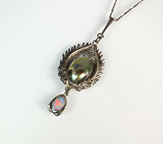 An Arts and Crafts abalone shell and opal pendant by Joseph Anton Hodel