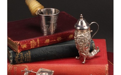 An Edwardian silver pepper, embossed with flowers and scroll...
