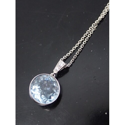 An aquamarine and diamond set pendant on an 18c gold chain