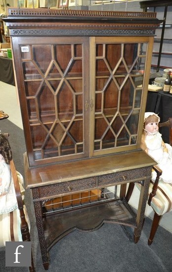 An early 20th Century mahogany collectors cabinet in the Chi...