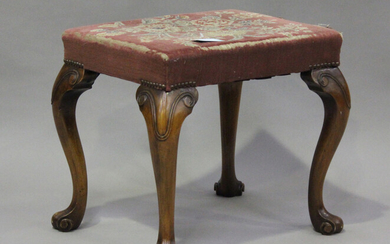 An early 20th century walnut stool, the tapestry seat raised on carved scroll legs, height 47cm, wid
