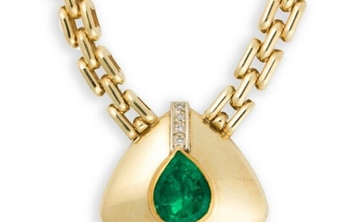 An emerald, diamond and fourteen karat gold pendant