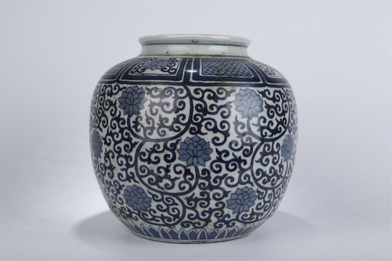 Blue-and-White Porcelain Jar with Interlocked Branches and Lotus Design....