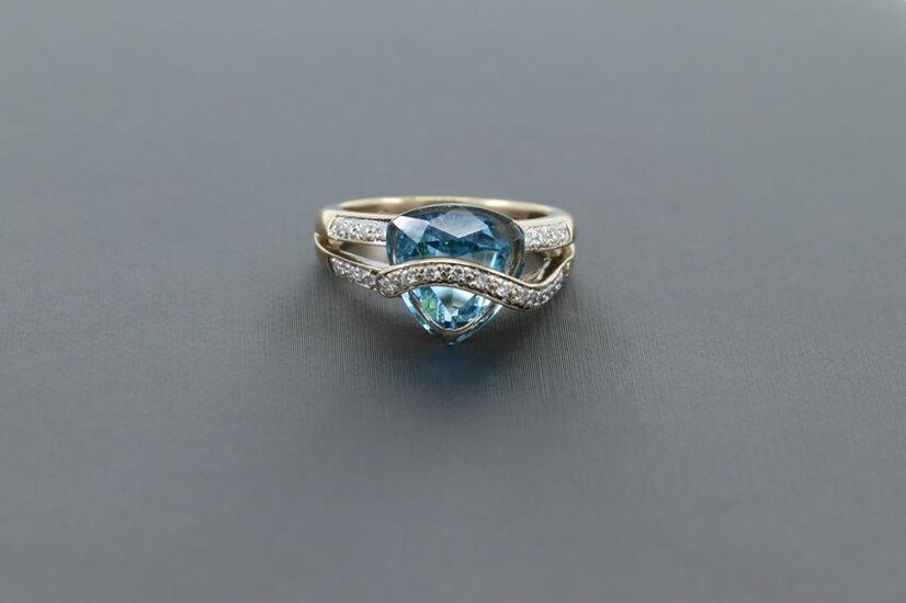 Blue center stone with Diamonds 14kt Yellow gold