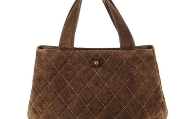 CHANEL - a brown suede Matelassé handbag. Designed with