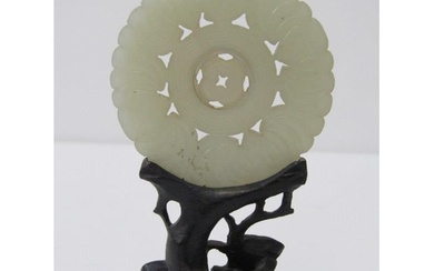 CHINESE JADE, carved Chinese jade disc, 5.5cm diameter on an...