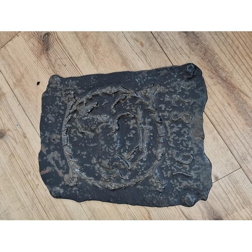 Cast iron plaque depicting a horse {41 cm H x 32 cm W}.