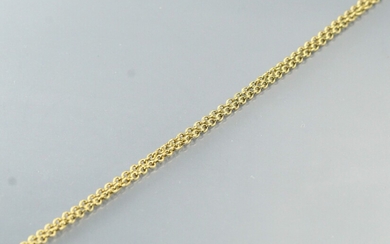 Débris d'or jaune 18k (750) : chaîne. Poids : 7.50 g.