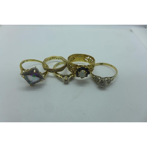 Five 9ct rings including a diamond solitaire, approx 0.10ct ...