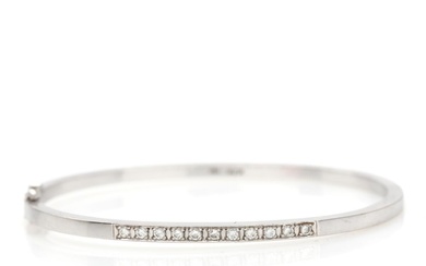 Flemming Lund A diamond bangle set with eleven brilliant-cut diamonds, mounted in...
