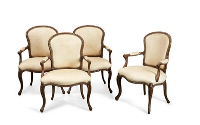 Four George III style mahogany open armchairs