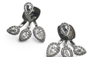Hartmann's: A pair of diamond ear pendants each set with pear-shaped and brilliant-cut diamonds weighing a total of app. 1.19 ct., mounted in 18k white gold.