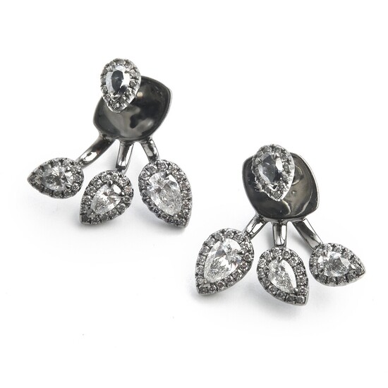 Hartmann's: A pair of diamond ear pendants each set with pear-shaped and brilliant-cut diamonds weighing a total of app. 1.19 ct., mounted in 18k white gold.