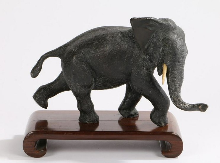 Japanese Meiji period bronze elephant, on a hardwood