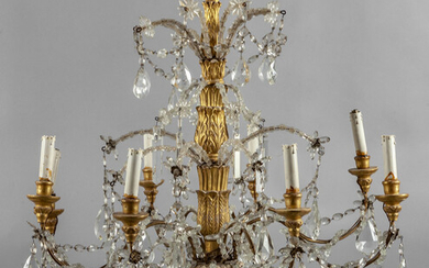 Lampadario in stile Luigi XVI a otto luci in legno finemente intagliato...