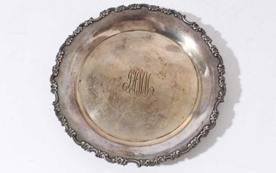 Late 19th century American silver card tray of circular form with floral and scroll border and central engraved initials, by Tiffany & Co, marks circa 1892 - 1902, together with a letter of provena...