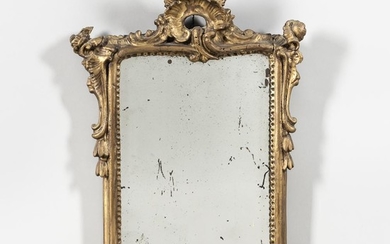 Louis XV Giltwood Mirror, France, 18th century, rectangular plate surmounted by stylized leaf and flower, scrolling side decoration wit