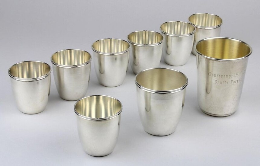 Nine beakers 800 and 925 silver, mostly Italy 2nd half of the 20th century, plain and simple form with profiled rim, 7 cups, 800er Silber, h: 5,8 cm, 1 silver cup, 800er Silber, h: 7 cm and a silver cup, 925er Silber, probably German, h: 9 cm, this...