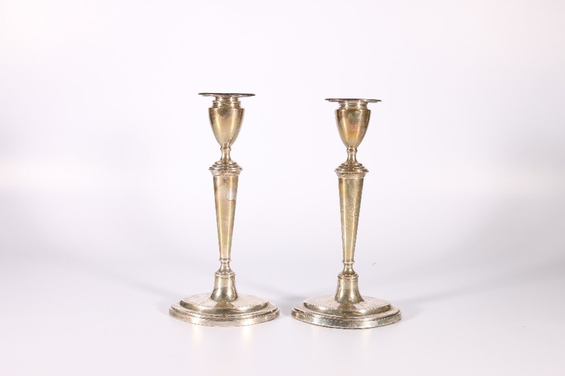 Pair of George V silver candlesticks raised on navette shape...