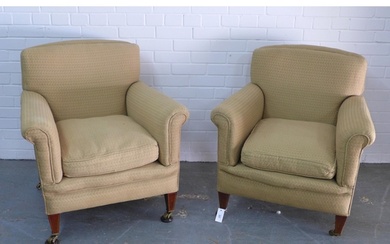 Pair of upholstered armchairs on mahogany legs with brass ca...