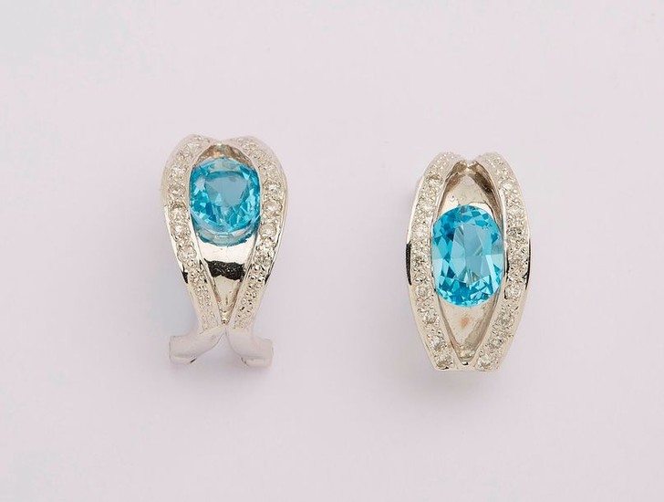 Pair of white gold earrings set with two...