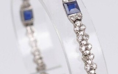Platinum bracelet decorated with about 120 small brilliants (one missing) and 6 sapphires. L : 17 cm, Weight : 15.3 gr.
