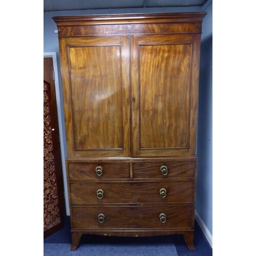 REGENCY FIGURED MAHOGANY CLOTHES PRESS, the moulded cornice ...