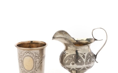 Rusian silver cup and Russian silver creamer. Late 19th century. (2).
