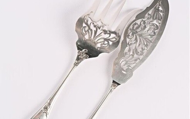 Silver fish service cutlery, the moving handle decorated with fillets and foliated scrolls, the openwork fork and blade decorated with foliated scrolls, encrypted.