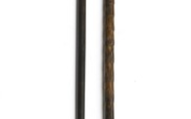 TWO CANES WITH IVORY HANDLES One handle carved with an Egyptian pharaoh. Other with a crook handle. Both with wooden shafts. One wit...