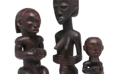 Three ancestor figures of carved patinated wood. Fang and Hemba style. H. 33–60 cm. (3)