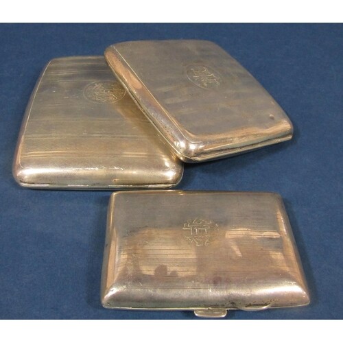 Three early 20th century silver engine turned cigarette case...