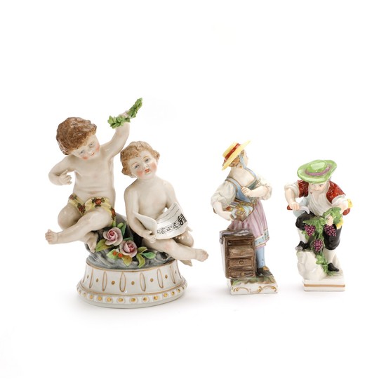Three porcelain figurines in the form of Allegory on music, Grapes picker and Girl with dresser. Volkstedt Rudolstadt, Ludwigsburg and Berlin. H. (3)