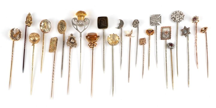 Twenty-Three Stick Pins; including a hexagonal citrine set pin, cased,...
