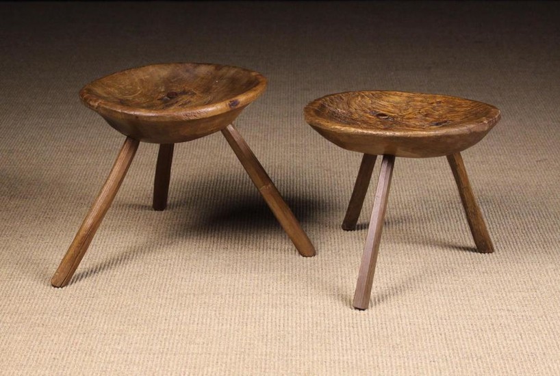 Two 19th Century Rustic Dish-topped Stools. The welled oval seats raised on three splayed chamfered