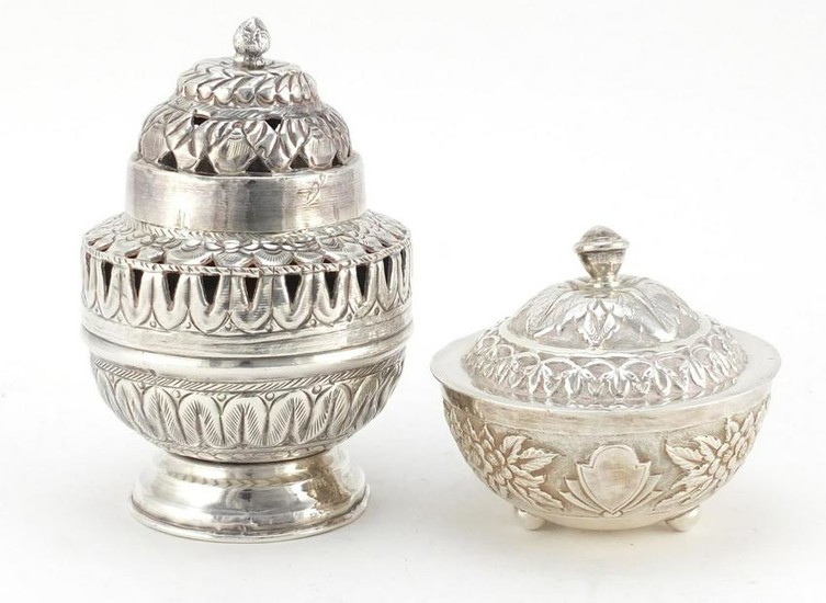 Two Indian silver coloured metal pots and covers, the