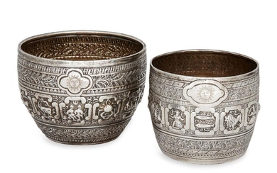 Two Victorian silver 'Zodiac' bowls, one Glasgow, c.1891, maker T.S., the larger example London, c.1873, Henry Holland, both repousse decorated with signs of the Zodiac beneath quatrefoil cartouches engraved with sun motifs, 8.6 and 10.1cm dia...