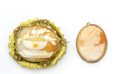 Two cameo brooches, one a classical cameo set within a .800 ...