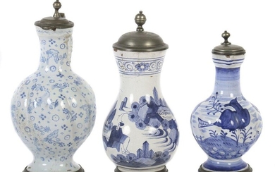 Two narrow-necked jugs and a pear jug Ansbach and others, 18th century, each with reddish shards, glazed, one narrow necked jug with birds decor, the other one with landscape depiction in blue, each with baluster-shaped, diagonal ribbed belly, plait...