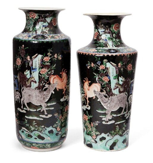Two similar Chinese porcelain famille noir vases, 18th and 19th century, each painted in famille verte enamels with domestic animals in a continuous garden landscape, 43 and 45cm high