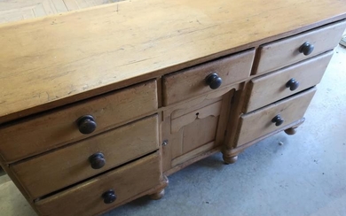 Victorian sideboard with central drawer above recessed cupboard door...