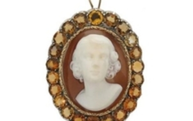 A shell cameo pendant, depicting a woman in relief…