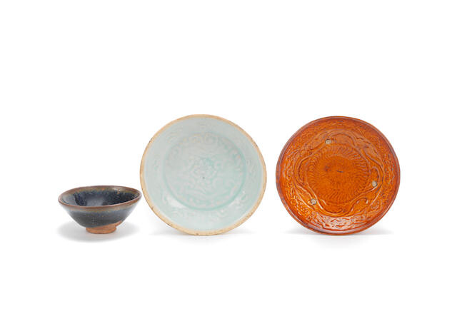 A varied group of three monochrome-glazed vessels