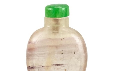 CHINESE PALE AMETHYST SNUFF BOTTLE In flattened ovoid form. Height 2.2". Glass stopper simulating jadeite.