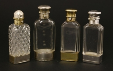 Four silver and glass combination scent bottles and vinaigrettes