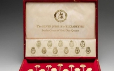 A modern set of eleven silver spoons commemorating the
