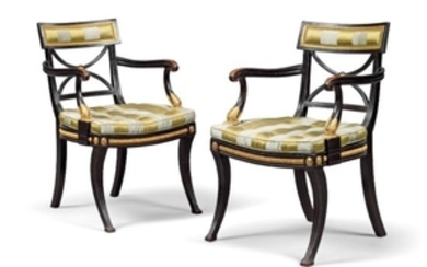 A PAIR OF REGENCY EBONISED AND PARCEL-GILT OPEN ARMCHAIRS, CIRCA 1800, IN THE MANNER OF THOMAS HOPE